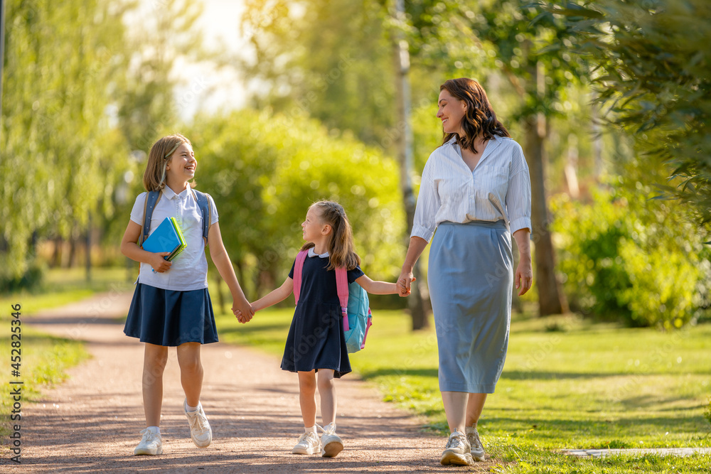 Parent and pupils going to school Parent and pupils going to school