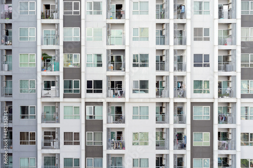 Balcony of condominium or apartment buildings windows. Glass architecture facade design in urban city, Downtown in city. Residential rooms.