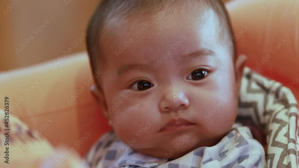 Adorable Asian baby girl lying on bed looking at camera.Cute little baby smiling and happiness relaxing in bed.Portrait of asian baby newborn in bedroom,Soft focus Adorable Asian baby girl lying on bed looking at camera.Cute little baby smiling and happiness relaxing in bed.Portrait of asian baby newborn in bedroom,Soft focus