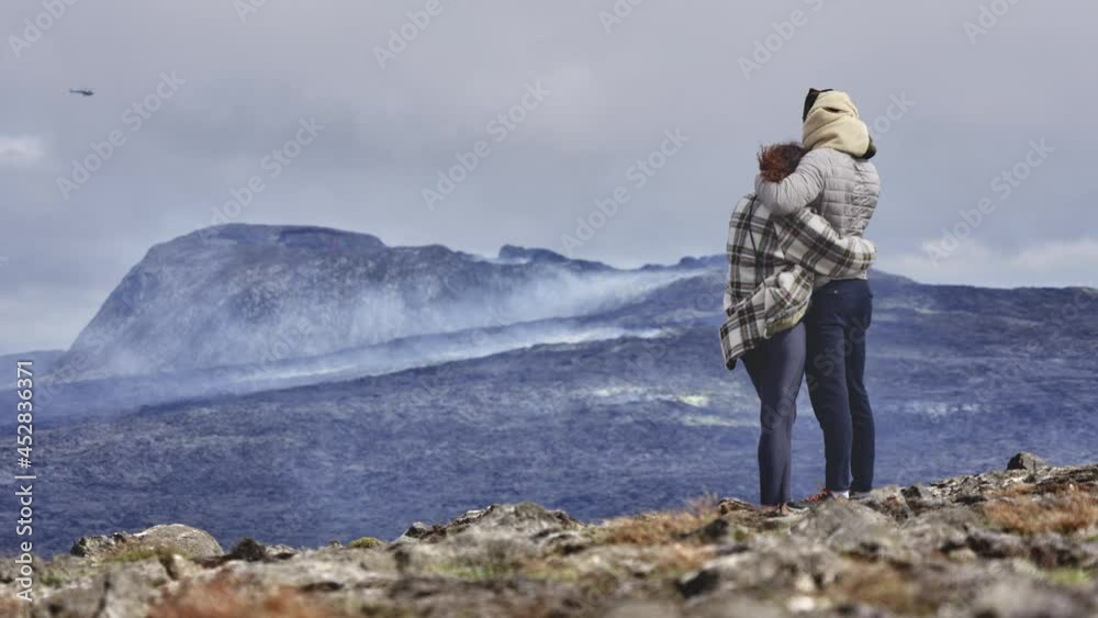 Aerial Shot of an Active Volcano in Iceland as an Adorable Couple Snuggling Aerial Shot of an Active Volcano in Iceland as an Adorable Couple Snuggling