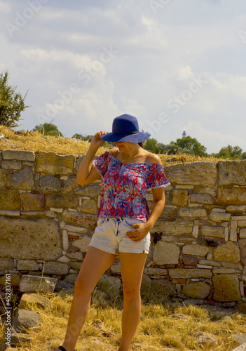 beautiful woman in a field in ancient city, turkey