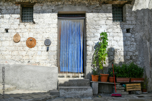 Facade of an old house in the historic center of Castelsaraceno, an old town in the Basilicata region, Italy. photo