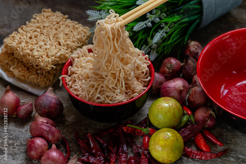 noodle in bowl with thai herb photo