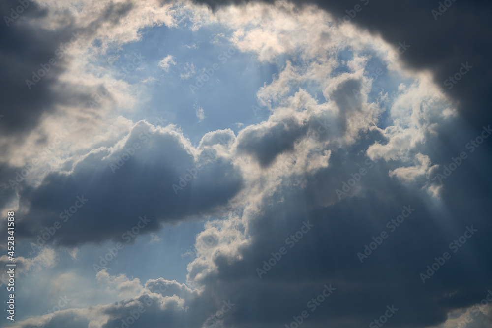 dramatic clouds float across the blue sky dramatic clouds float across the blue sky