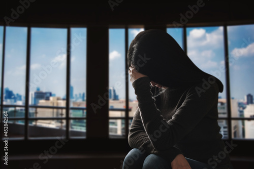  woman sit Depression Standing by window