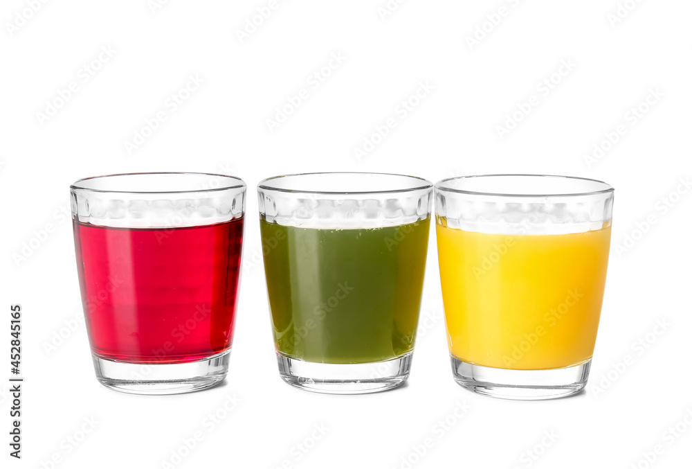 Glasses with healthy juice on white background Glasses with healthy juice on white background