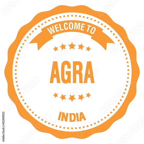 WELCOME TO AGRA - INDIA, words written on orange stamp