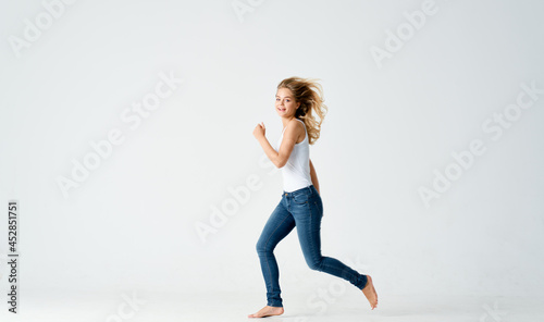 woman in jeans barefoot Positive light motion background