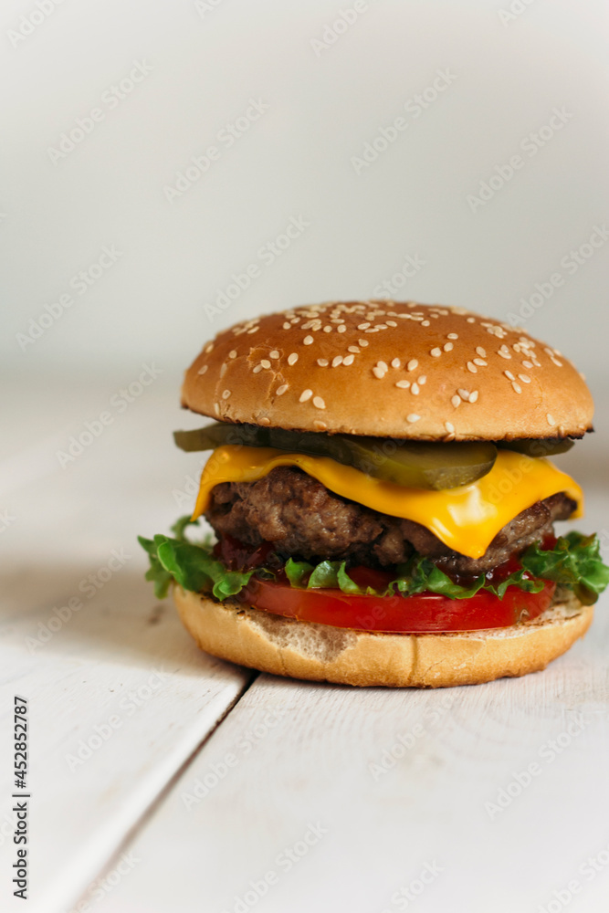 juicy burger on a wooden background