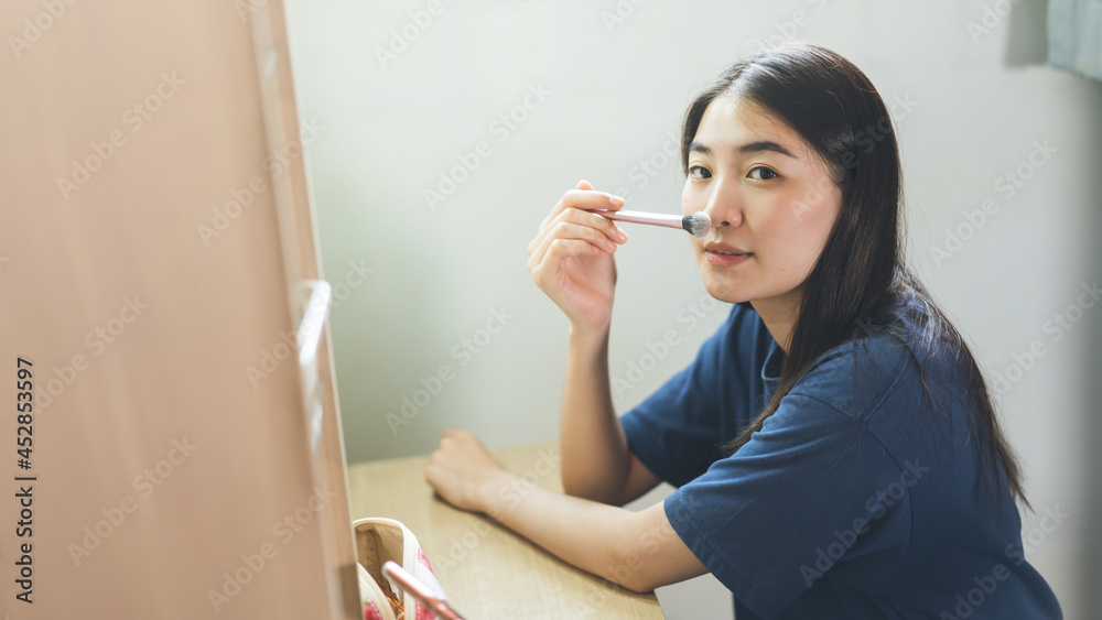 Portrait of single stills wellness young adult asian woman makeup before mirror at home Portrait of single stills wellness young adult asian woman makeup before mirror at home