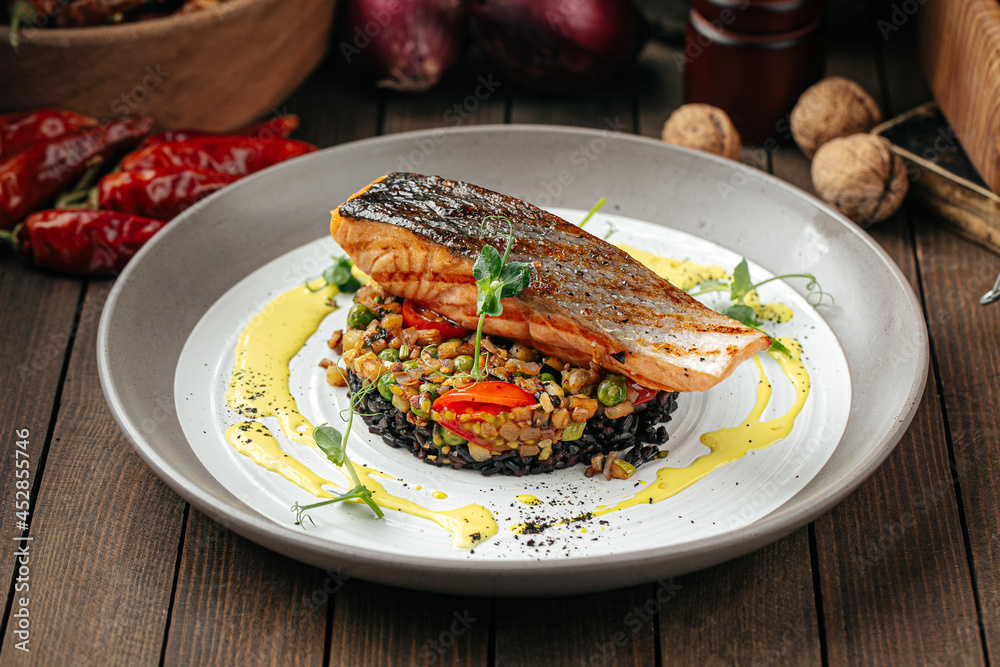 Gourmet salmon fillet with creamy basil sauce and black rice Gourmet salmon fillet with creamy basil sauce and black rice