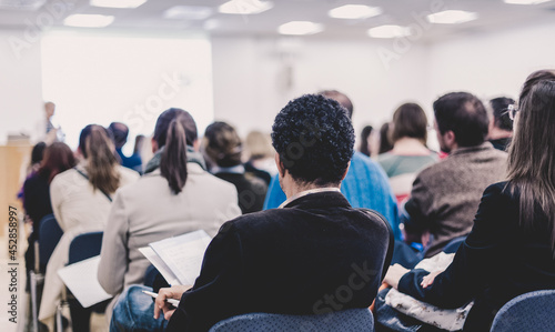 Woman giving presentation on business conference.