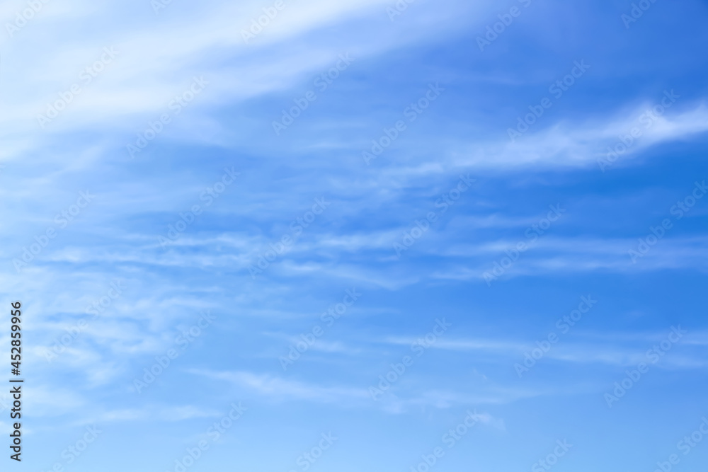 Soft clouds sky on bright blue with vast space background