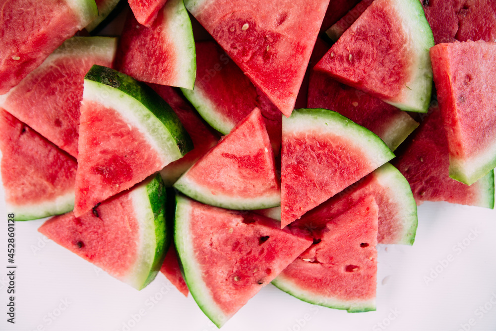 Pieces of watermelon on a wooden table close up Pieces of watermelon on a wooden table close up