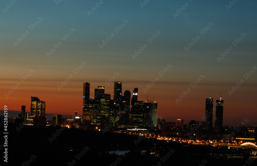 Scenic sunset in Moscow, Russia.  Multicolored sky. Silhouette of Moscow International Business Center