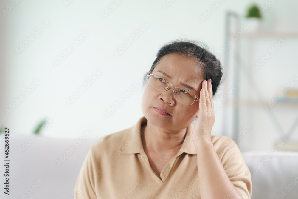 Exhausted tired depressed stressed thoughtful mature senior woman suffering from headaches, Brain diseases, mental problems, Alzheimer Concept.. Exhausted tired depressed stressed thoughtful mature senior woman suffering from headaches, Brain diseases, mental problems, Alzheimer Concept..