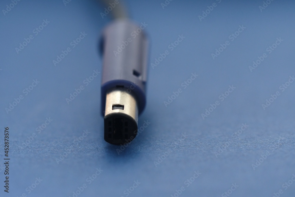 Closeup macro of a cable on blue background Closeup macro of a cable on blue background