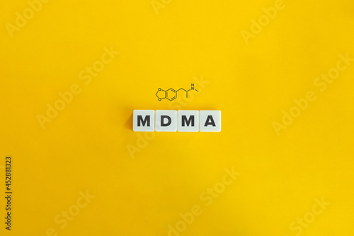 MDMA banner and concept. Block letters on bright orange background. Minimal aesthetics.