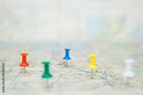 Selective focus of Colorful Many pins  on map background