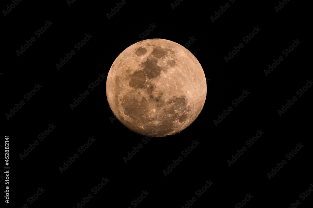 Ninety Nine Percent Full Moon in a hazy smoky night sky Ninety Nine Percent Full Moon in a hazy smoky night sky