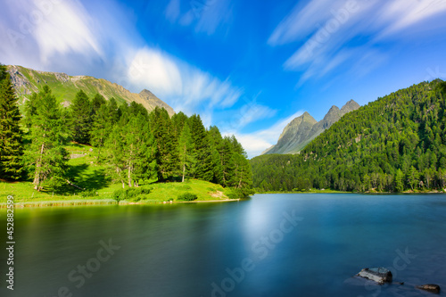The alpine lake in the Swiss Alps of Palpuogna below the Albula pass photo