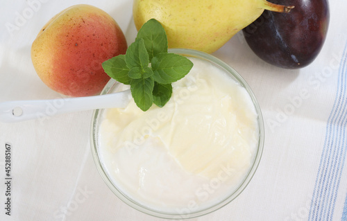 Natural yogurt or yoghurt with cream and fruits photo