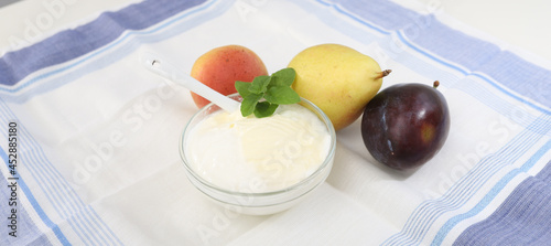 Natural yogurt or yoghurt with cream and fruits photo