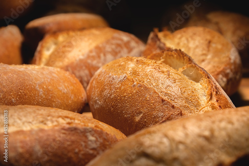 Fresh artisan bread. Loaves of delicious wholesome natural hot bread. Healthy food production and proper nutrition concept