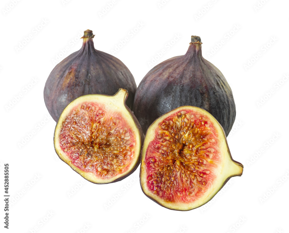 whole and cut figs on a white background whole and cut figs on a white background
