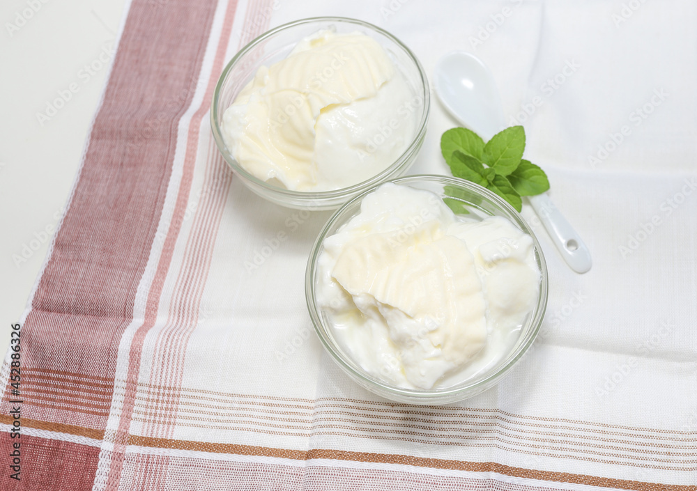 Natural yogurt or yoghurt with cream and mint Natural yogurt or yoghurt with cream and mint