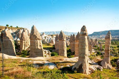 Beautiful Cappadocia mountains in the Valley of love, Goreme city in turkey. Morning, sunny day. Travel concept