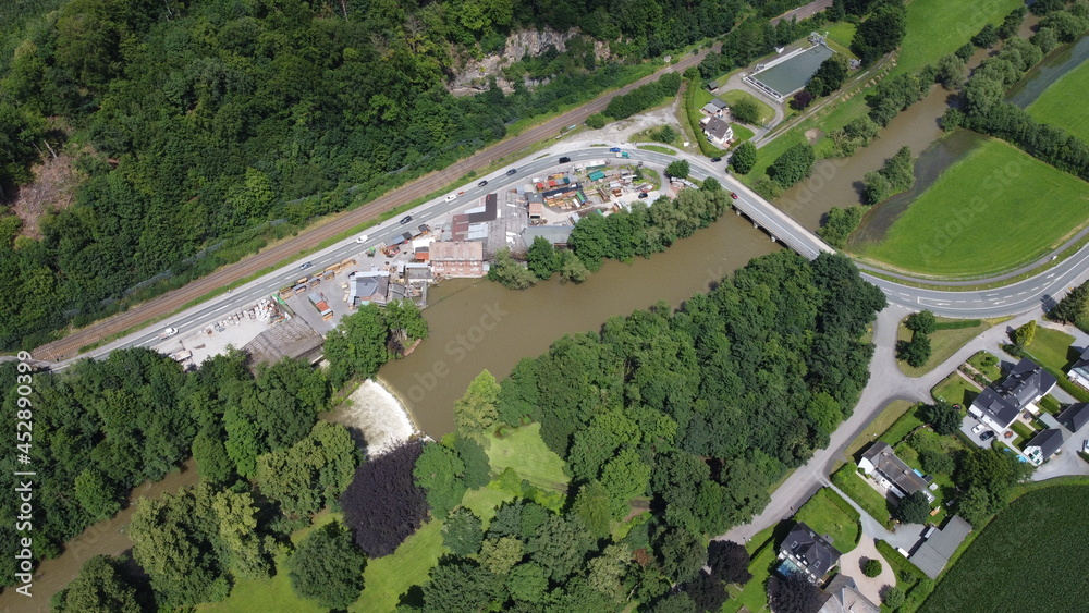 Industrial area near a flooding river - aerial view