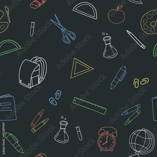 Seamless pattern with hand drawn school elements doodle on blackboard