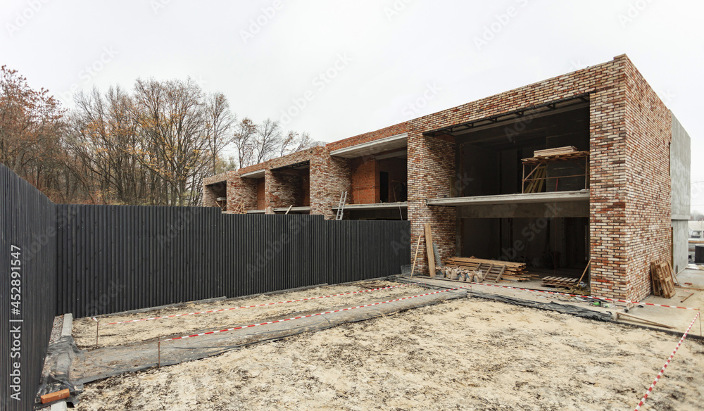 Construction process of new residential building at construction site. High quality photo Construction process of new residential building at construction site. High quality photo