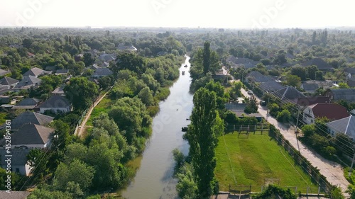 Aerial view on Vilkovo city. Flight over the city and the canals that connect the houses. A city Vylkovo on the water in Ukraine. photo