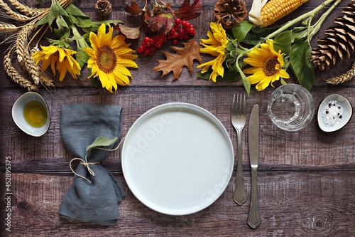 Table scape for Thanksgiving day dinner. Table decoration for festive autumn family party. Rustic style, selective focus