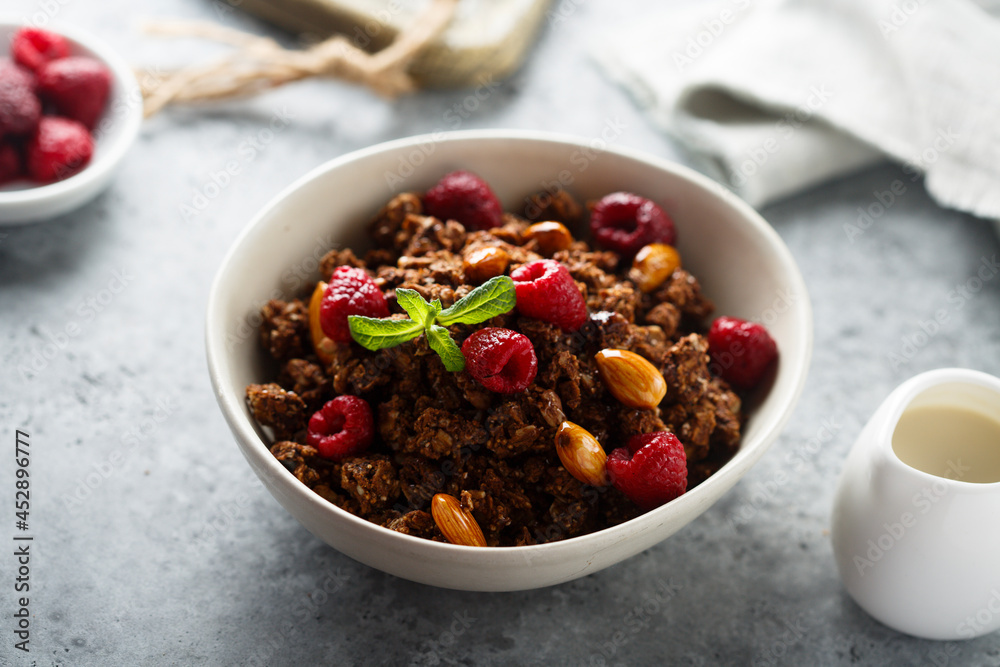 Homemade chocolate granola with raspberry Homemade chocolate granola with raspberry