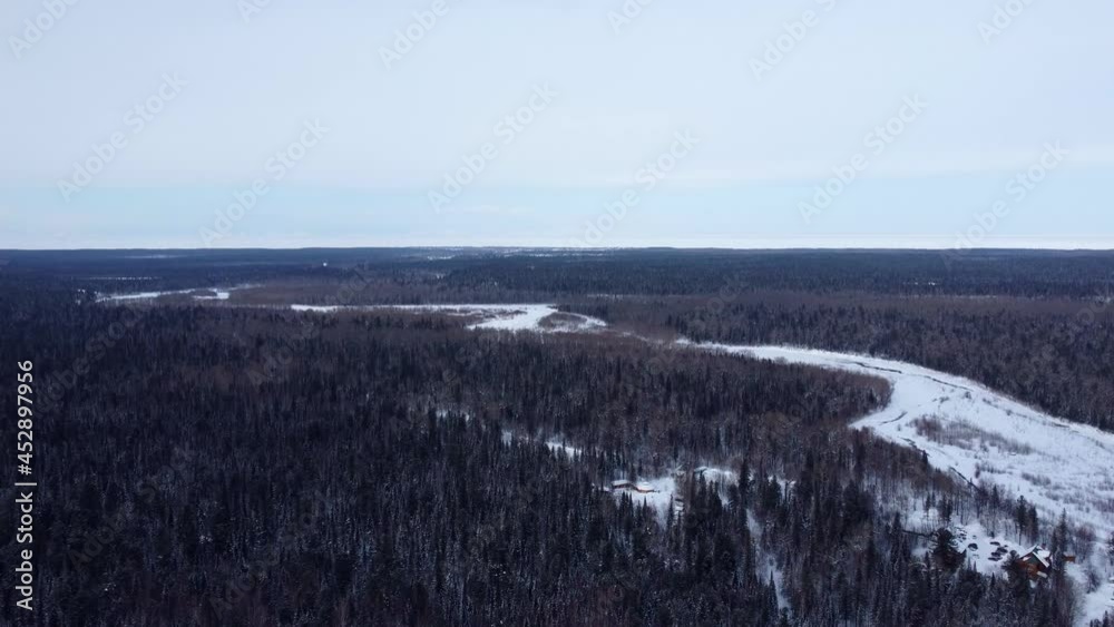 drone flight over frozen river near mountain with winter forest in winter
drone flight over frozen river near mountain with winter forest in winter