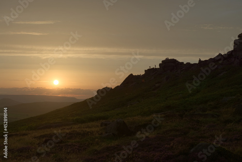 Wide angle sunset at stanage edge, with many people outdoors at sunset © Rhys