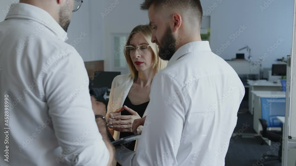 Close up view of colleagues in a company office Close up view of colleagues in a company office