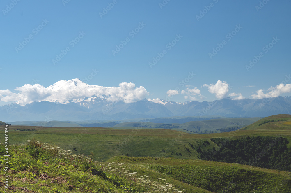 Beautiful plain landscape with snowy mountains in the distance. Beautiful plain landscape with snowy mountains in the distance.