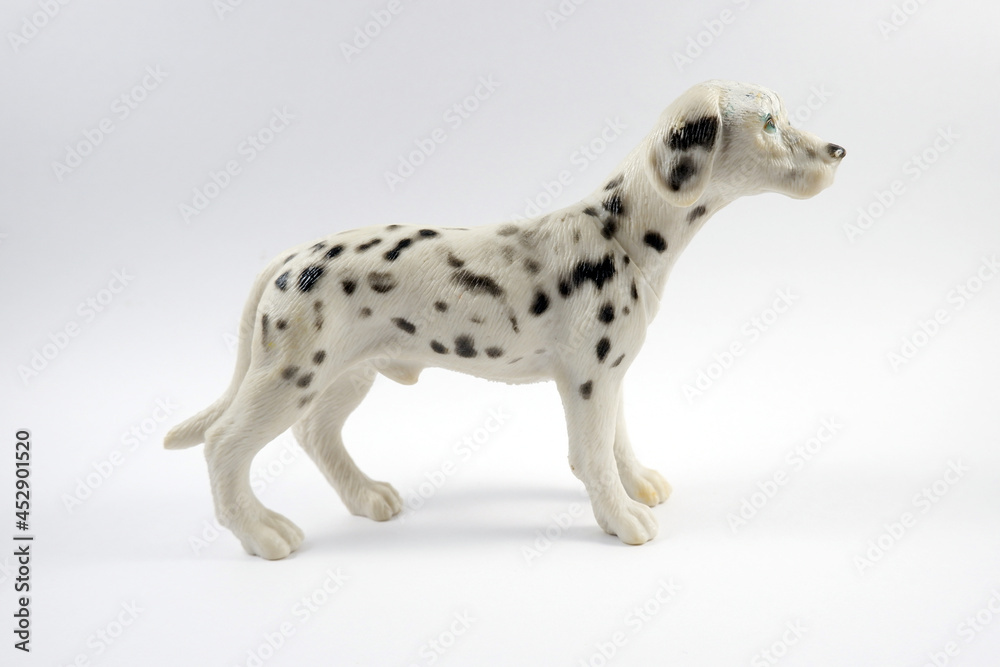 Toy dog figurine isolated on white background