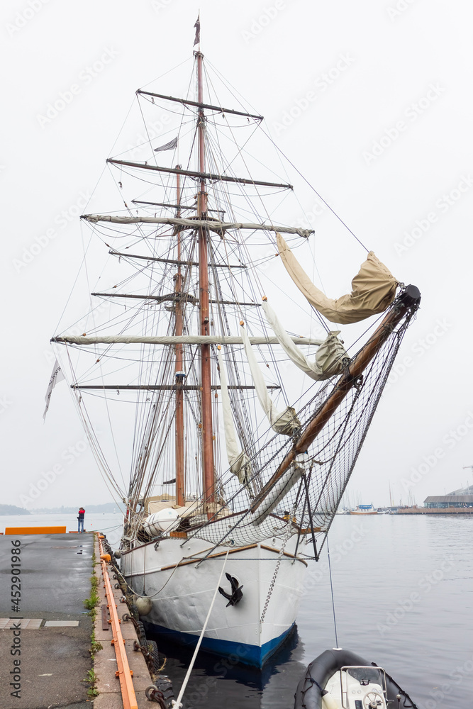 Brig class sailing ship moored at a pier Brig class sailing ship moored at a pier