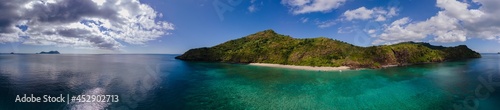 Drone view of white sand beach of Mayotte turquoise lagoon