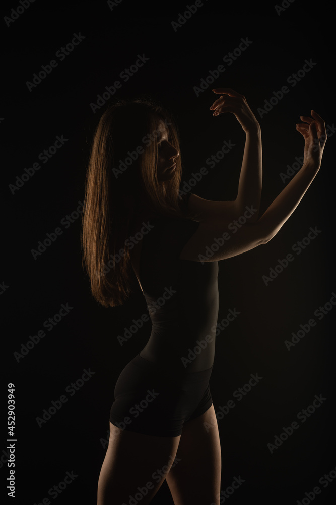 Silhouette of female posing