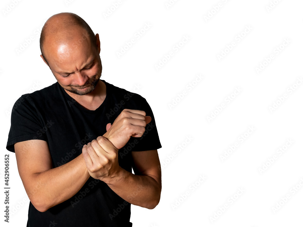 Man holding his wrist in pain from a strain or other medical condition. Man holding his wrist in pain from a strain or other medical condition.