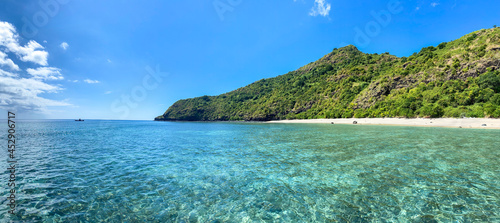Drone view of white sand beach of Mayotte turquoise lagoon