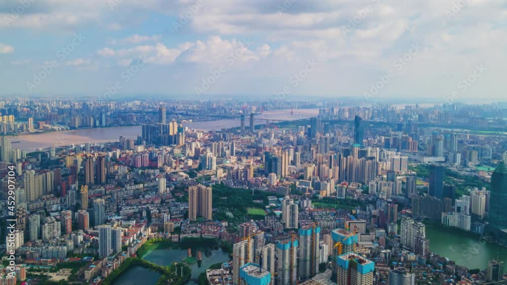 Timelapse of Aerial view of Wuhan skyline and Yangtze river with supertall skyscraper under construction in Wuhan Hubei China.