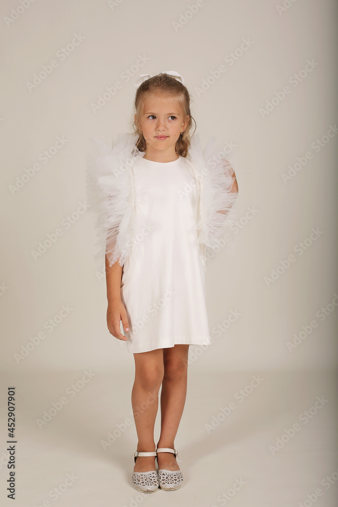 beautiful blonde girl in a white dress with wings holiday birthday beautiful blonde girl in a white dress with wings holiday birthday