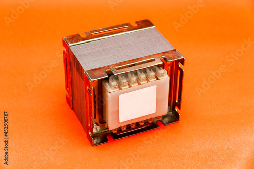Electrical transformer (square type) isolated on red background